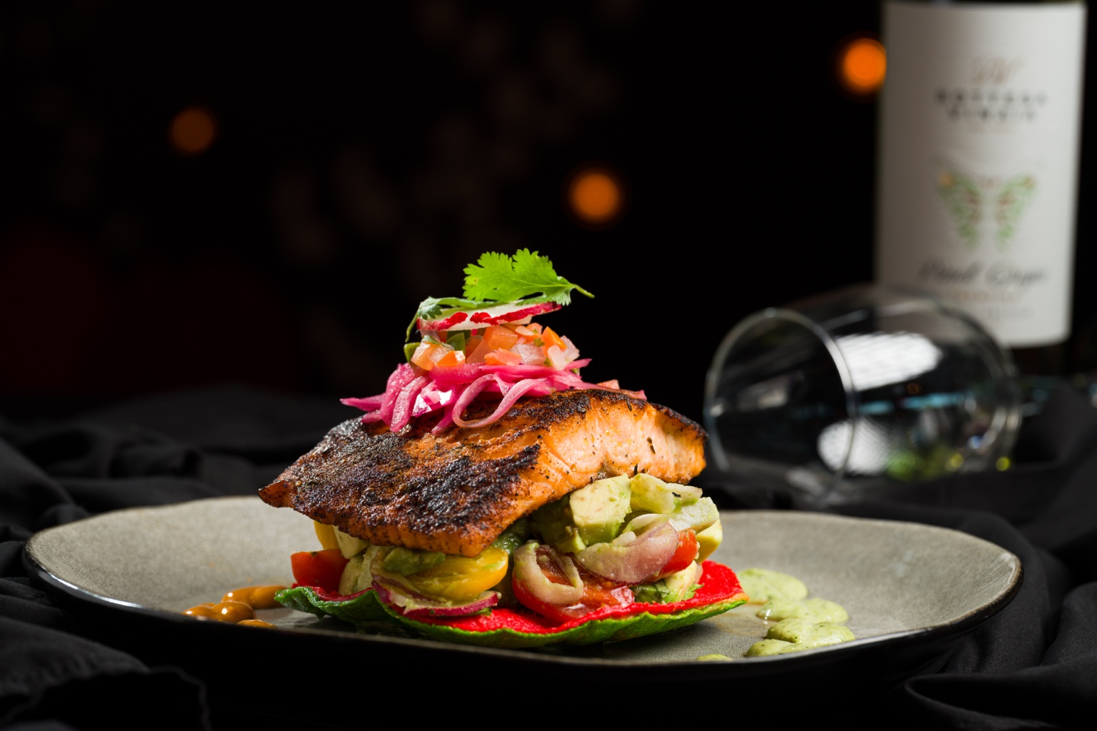 Salmón Yucateco, a signature entrée at COLOSSAL Restaurant